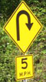 
Tight curve speed warning sign (5 mph)