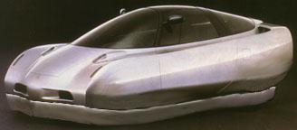 Prototype of a silver Honda low cost future automobile or car